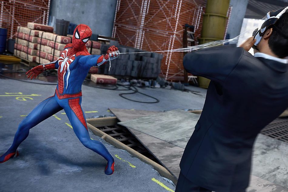 Spider-man slinging a web at a person's face