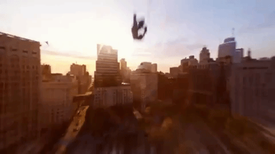Animated gif of spiderman doing his spider thing during sunset in NY