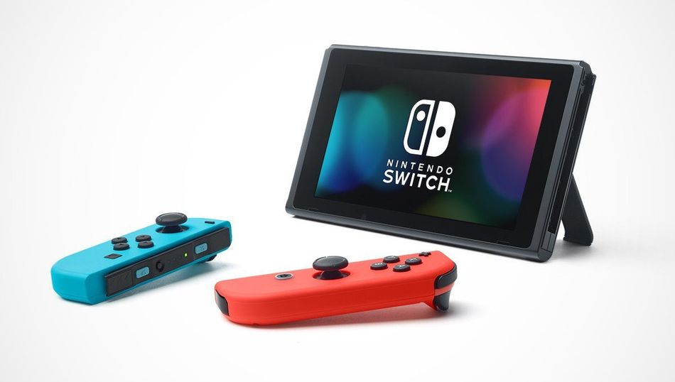 Nintendo Switch with one blue and one red joycon on a white background.