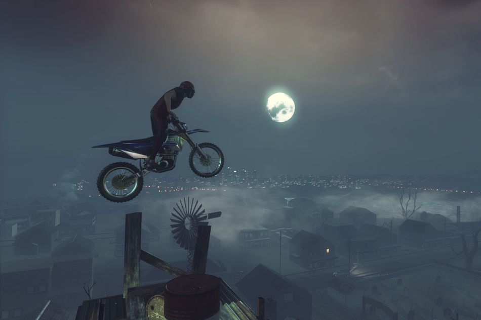 Picture of a dirt bike rider flying through the night sky in Trials Rising
