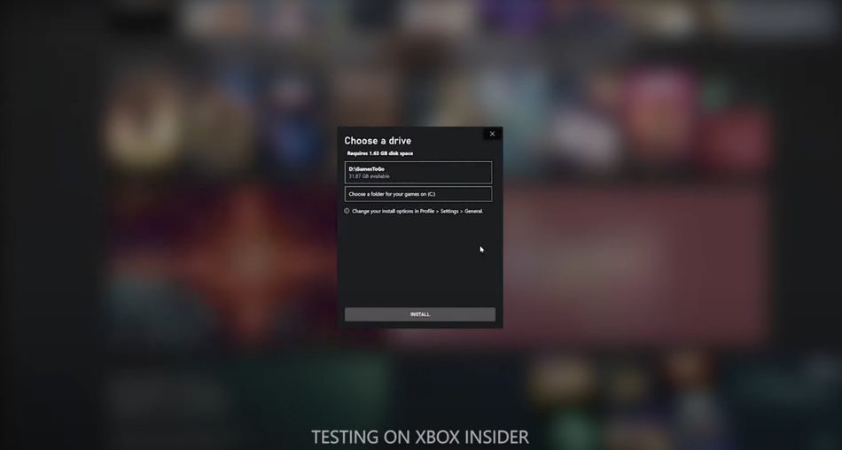 You will be able to change the download folder on Xbox app very soon