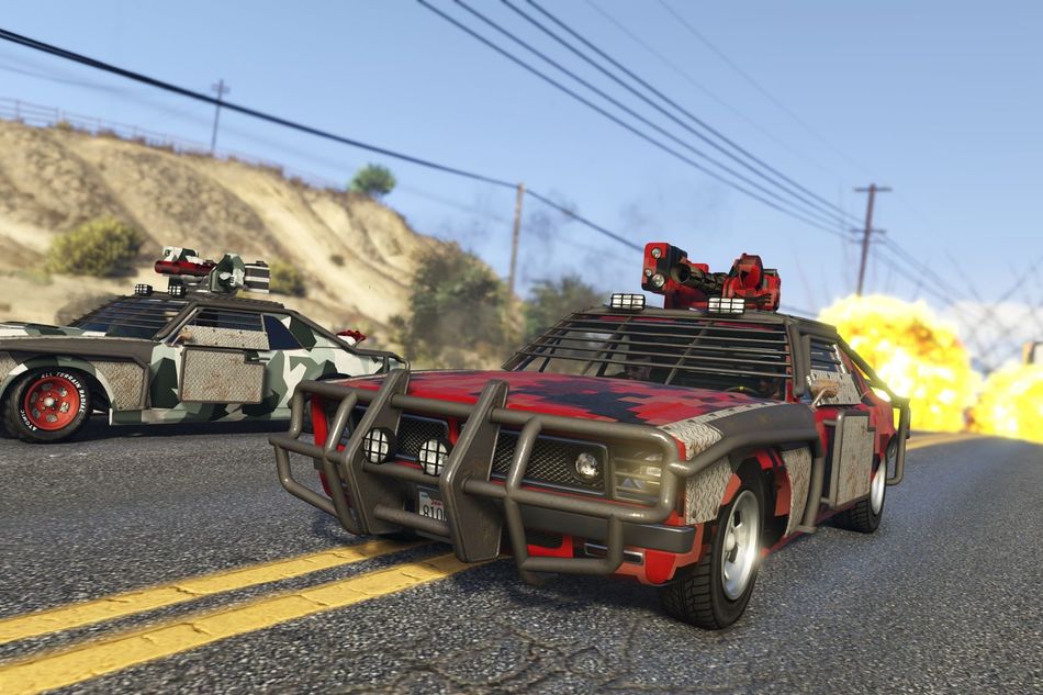 Screenshot from GTA V showing two heavily armoured cars racing on a highway.