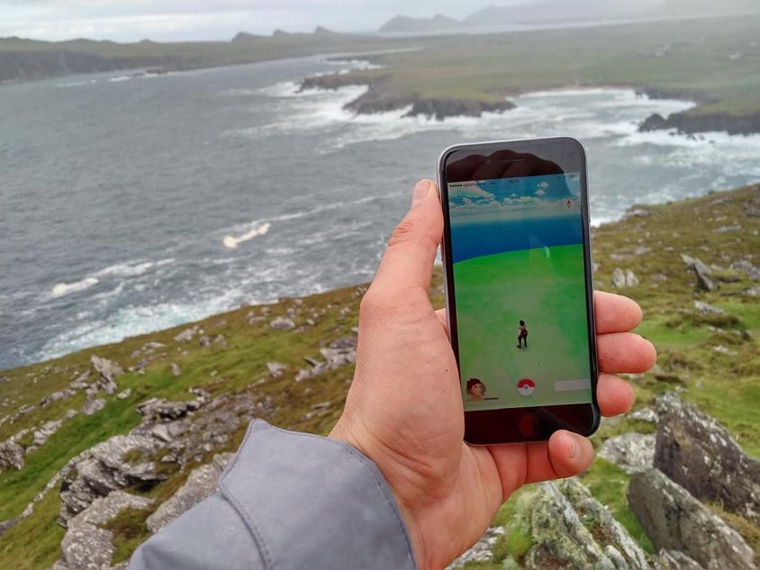 Pokemon GO player enjoying dramatic scenery - and the game at the same time AltChar.com