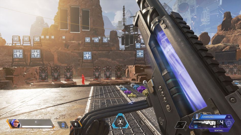 Apex Legends character reloading a gun in first-person
