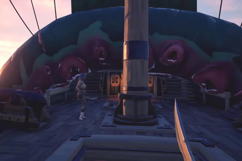 A large tentacle taking a hold of a ship, with a pirate standing by