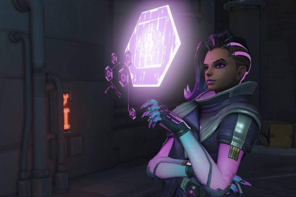 Sombra looking at one of her holo displays