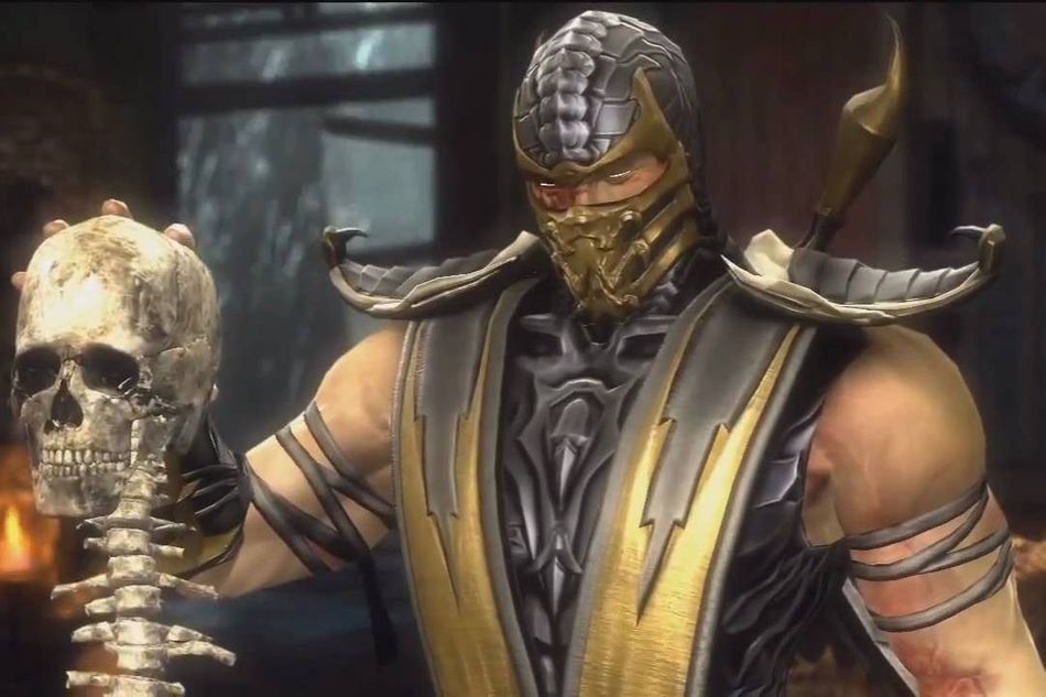 Scorpion is holding Sub-Zero's skull and spine after performing a fatality