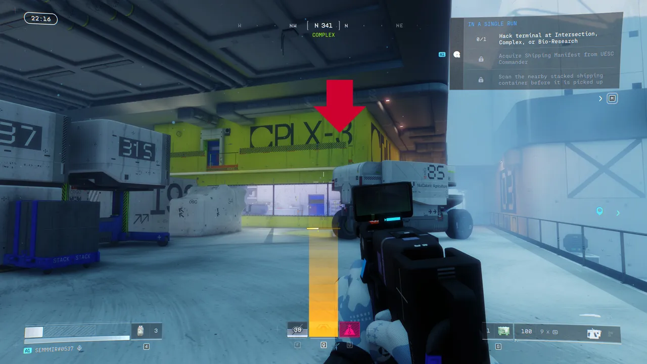 At Complex, the terminal sits on the yellow-green catwalk inside the building — follow the arrow to find it quickly.