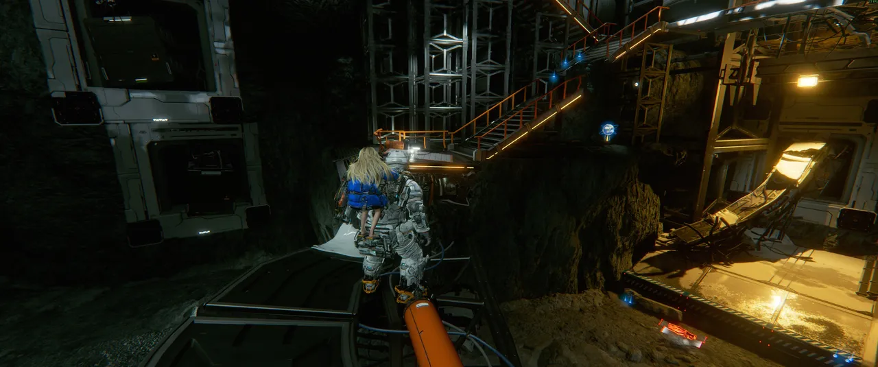This is the exterior low-gravity section. Cross the broken bridge and head toward the stairs ahead. The flying bot appears here, so be ready before you start climbing.