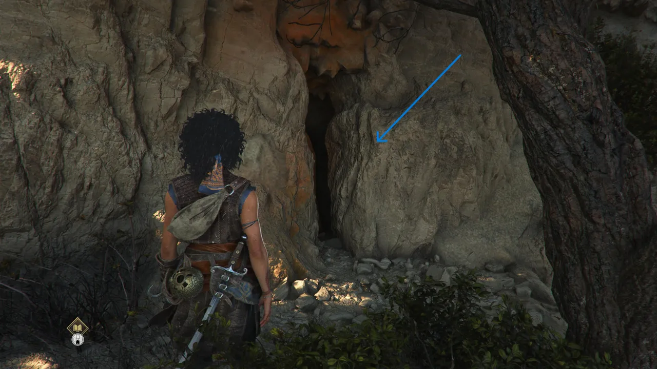 The opening in the cliff, next to the trees, is the correct way to proceed.