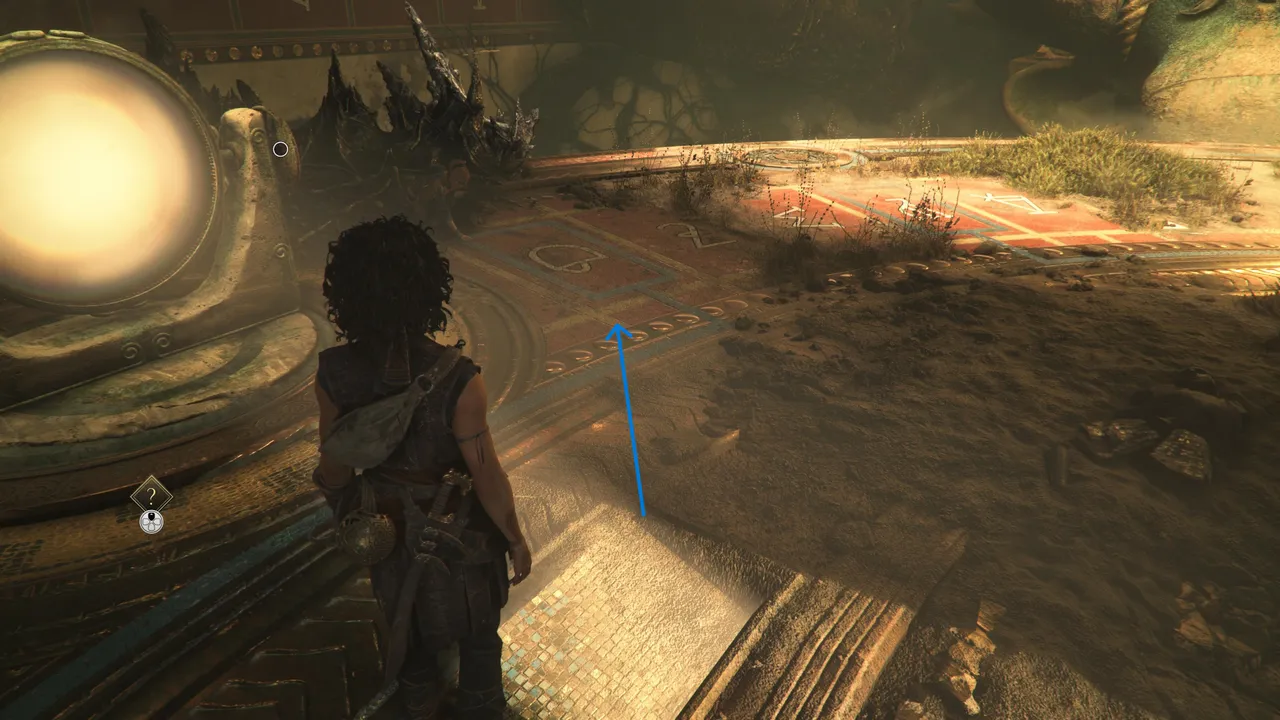 The second symbol is next to the left lens, and looks like a weird umbrella.