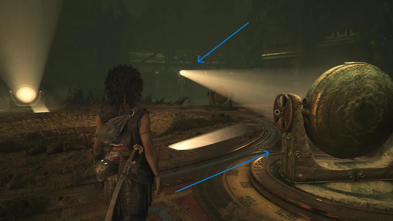 Point the lens towards the symbol on the wall.