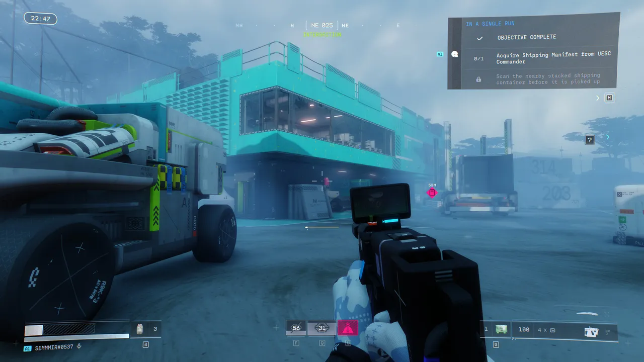 The terminal at Intersection is on the second floor of the cyan building — clean access, but watch for enemies inside.