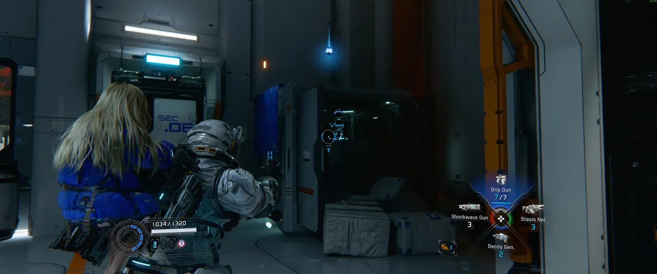 The open container is right next to the SEC .06 door. The figurine is inside. It sounds obvious once you know, but it's trivial to walk straight past in a noisy room.