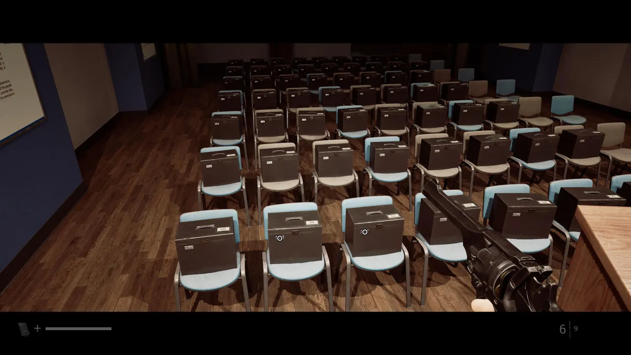 Rows of conference room chairs, each fitted with a numbered, locked case.