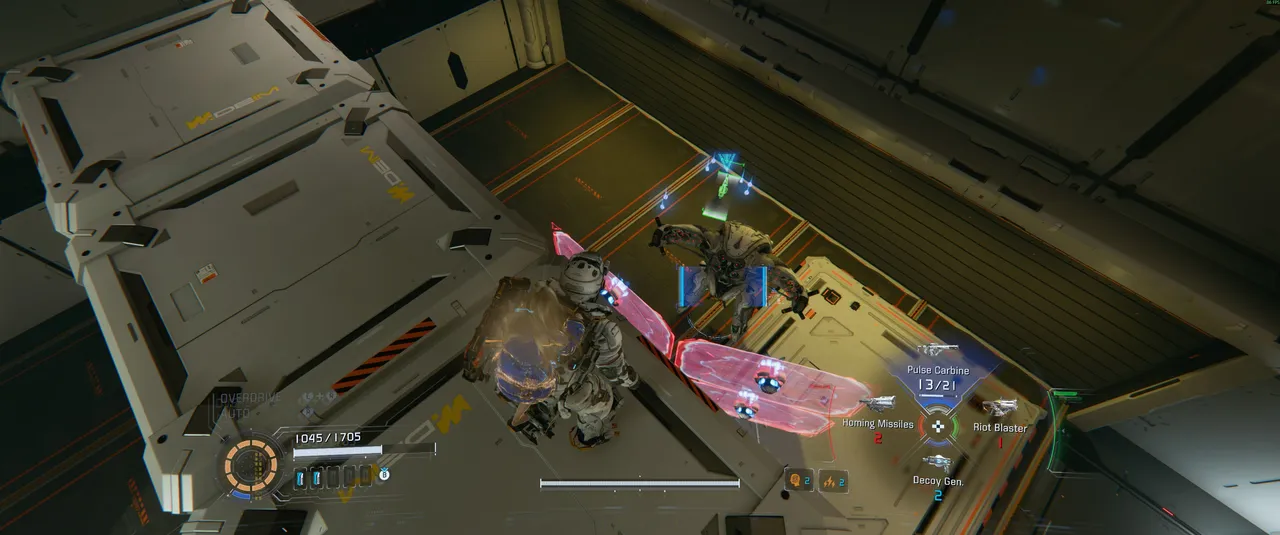 This is the vantage point you are looking for. Stay on top of the crates and look down at the shield bot below. It cannot reach you from here, which gives you all the time you need to set up the hack.