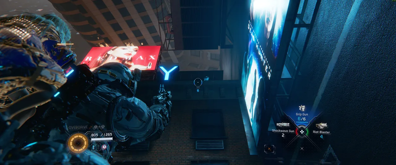 The figurine is right on the edge of the building, next to the Y. You won't see it from ground level, so listen for the sound as soon as you step off the elevator.
