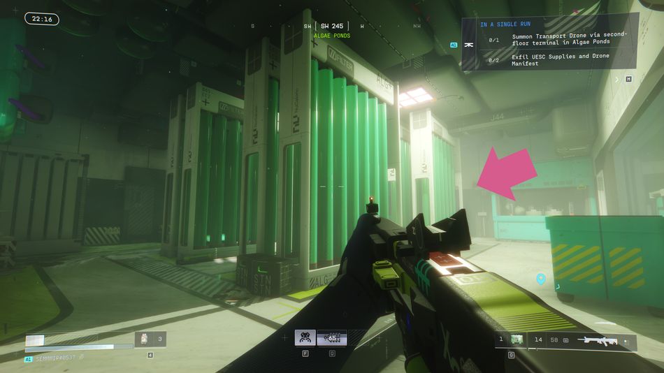 Follow the green-lit hallway through the plastic curtains and past the large filter units - the terminal is just behind them.